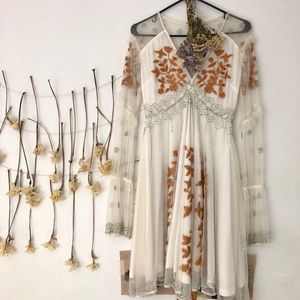 white beaded mid length dress